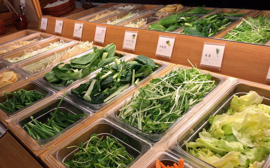 A variety of vegetables, including mushrooms, potatoes and cabbage, are offered in Nabezo's all-you-can-eat hot pot course.