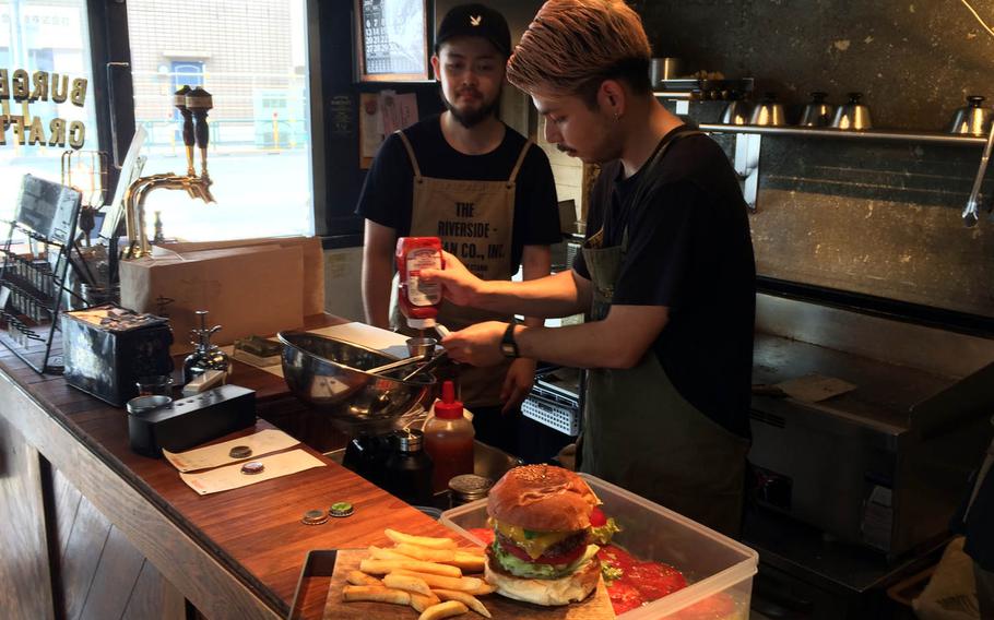 The burgers are stacked high at McLean Old Burger Stand in central Tokyo.