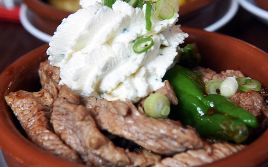 Grilled beef strips with freshly made sour cream at Tapasitos in Nuremberg, Germany.
