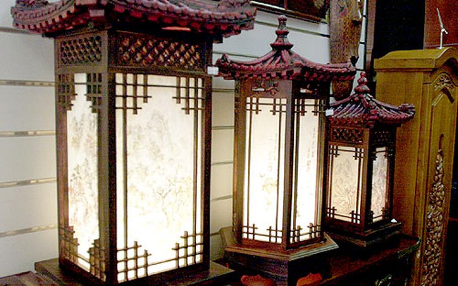 Lamps with elaborate paper shades are widely available in Korean shops, and are a popular item to take home. The large lamp is $125, while the medium is $87 and the smallest is $65.00.