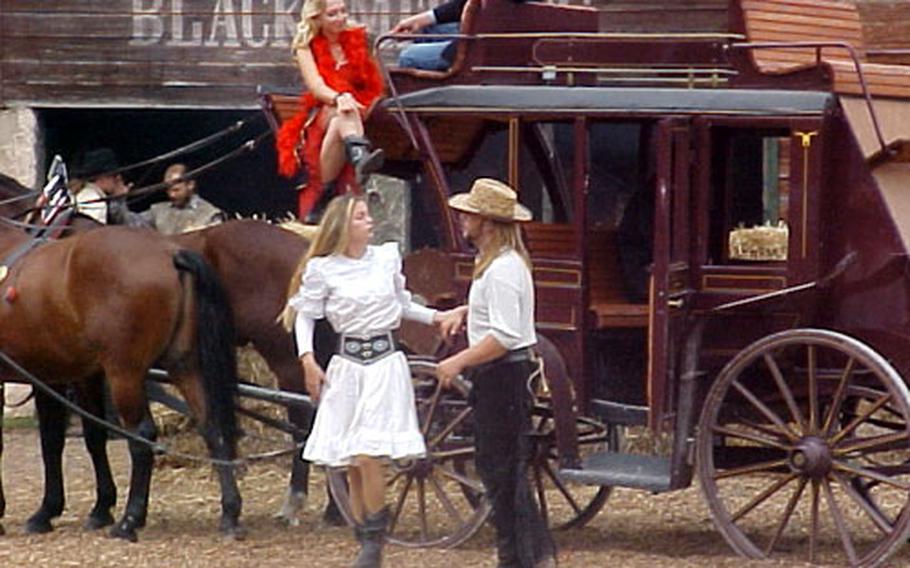 Performers act out a Western scene at the Schloss-Thurm, near Bamberg, Germany.