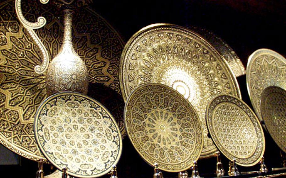 A display of damascene work at Fabrica Bermejo in Toledo, Spain. Damascene, or “damasquinado," is the Moorish art of inlaying gold or silver threads into black steel. It is a popular handicraft not only in Toledo but also throughout Spain.