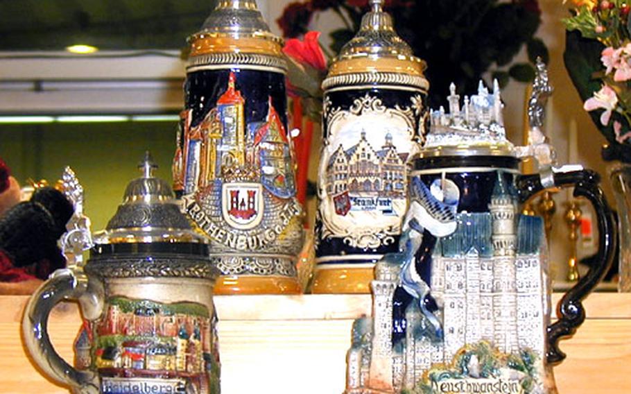 Some beer steins represent historic sites throughout Germany. From left are Heidelberg castle, Rothenburg ob der Tauber, Frankfurt am Main and Neuschwanstein castle.