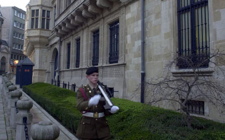 A soldier marches outside the Grand Ducal Palace in Luxembourg.