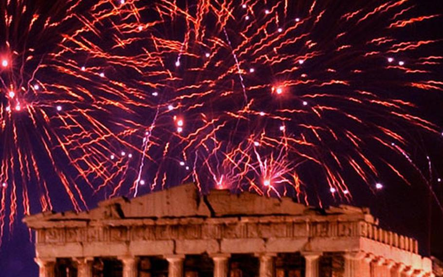 Fireworks illuminate the ancient Parthenon on the top of Acropolis Hill in Athens, Greece, Tuesday, Jan. 1, 2002, at the start of the New Year.
