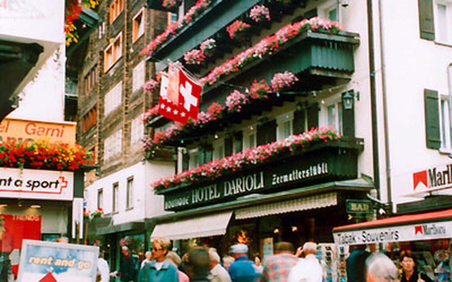 Zermatt’s Bahnhof Strasse is a busy place lined with shops, hotels and restaurants.