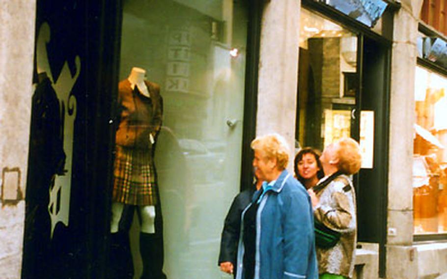 Visitors window shop in St. Moritz, Switzerland, which boasts sophisticated designer boutiques. This mountain retreat attracts the rich and famous as well as those who want to rub elbows with them.