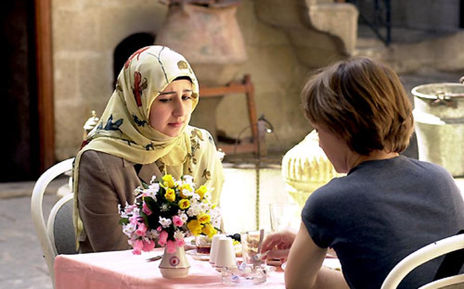 Turkey’s secular majority and conservative Muslim minority blend seamlessly in southeastern Turkey. Two women — one in modern dress, the other wearing a head scarf — meet for breakfast in Sanliurfa.