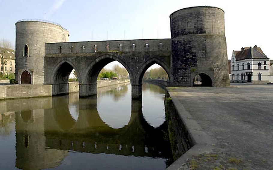 The Pont des Trous, a 13th-century fortified bridge, still stands over the Schelde river. It was part of the old city wall, and controlled river entry to the town.