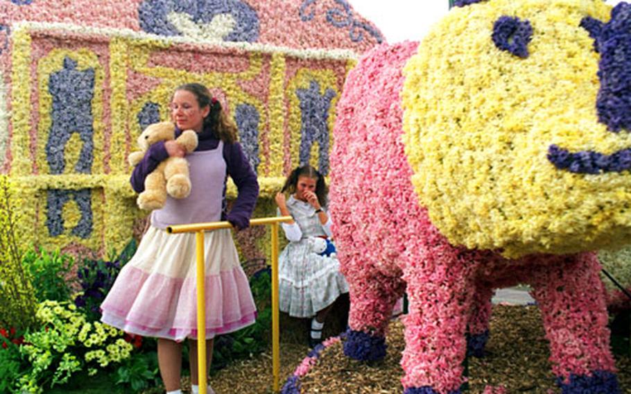 Thousands of pastel hyacinths created this float, featuring a large panda bear standing guard.