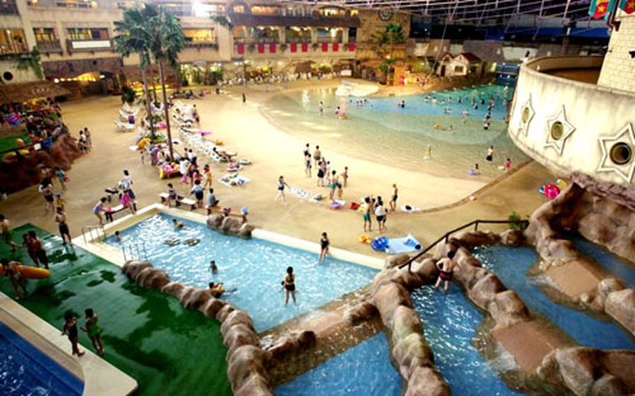 Terraced waterfalls and a kiddie pool, in foreground, provide calmer water fun for youngsters at Kenji World water park.