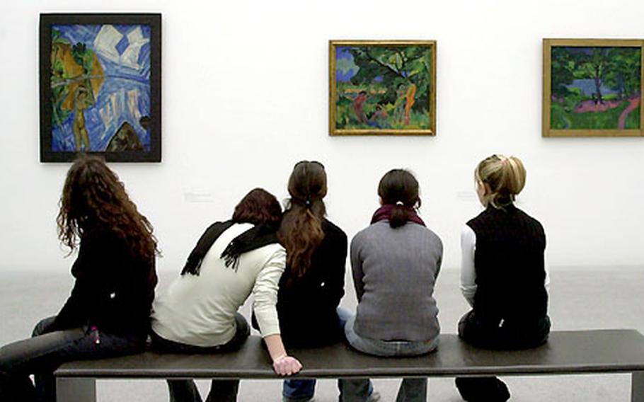 Italian students examine Expressionist works at the Pinakothek der Moderne, Munich’s new modern art museum.