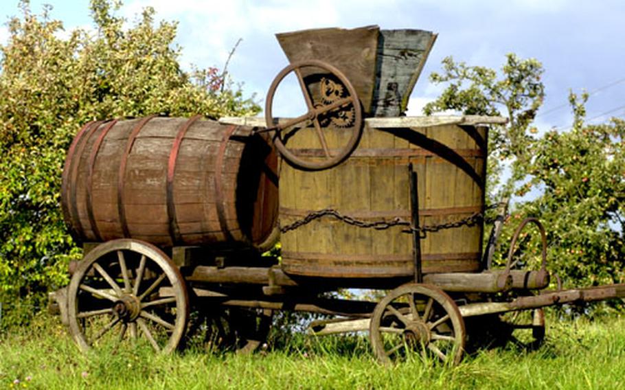 Old-fashioned wine-making equipment is displayed in the vineyards above Schweigen, Germany, at the end of the German Weinstrasse.