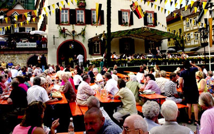 Participants sample the offerings at a wine fest in Oppenheim.