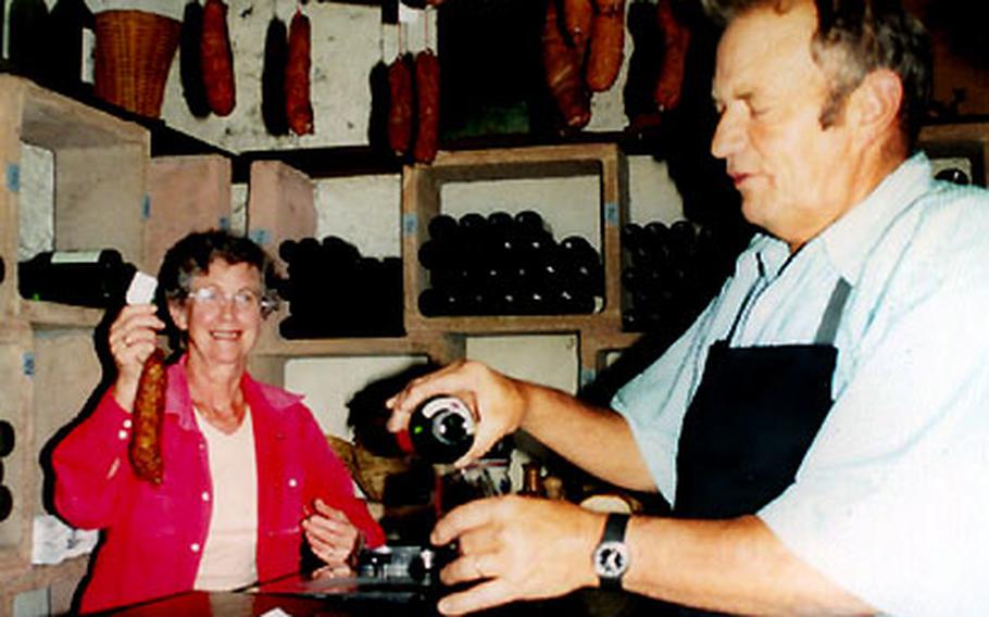 Leon Fonjallaz and his wife, vintners in Epesses, Switzerland, serve their wine — as well as cheese and sausage — at the village Caveau des Vignerons.