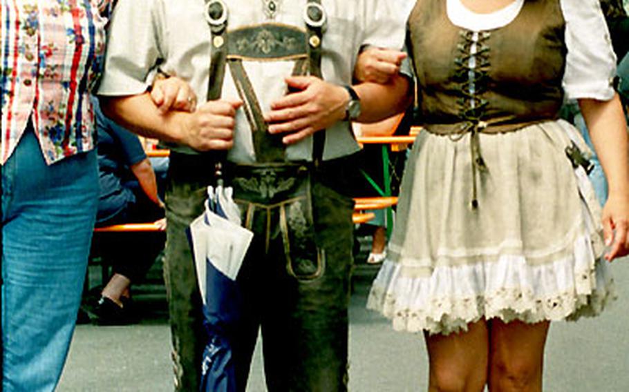 Bavarians in their traditional costumes arrive at the wine fest at Zeil, Germany.