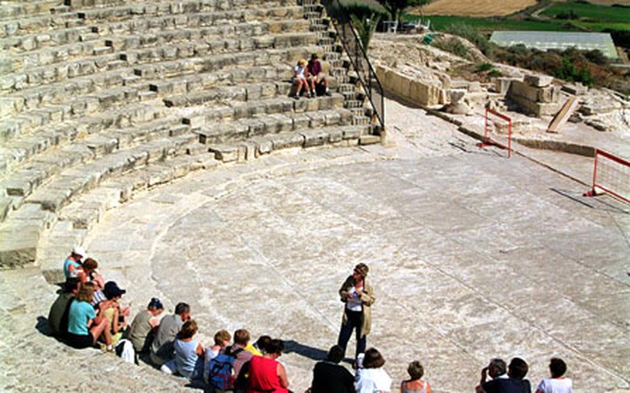 A guide explains the history behind the Kourion amphitheater, which is still used for plays and concerts.