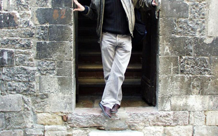 Marco Bellanca, an Italian licensed to give tours in the Italian region of Umbria, explains how elevated doors such as this one were used partly as a means of defense for households in cities such as Assisi hundreds of years ago.