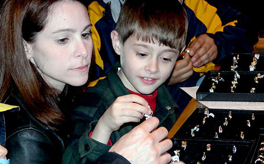 Amy Kieser and her son, Quentin, look at rings at the Stoeltie Diamonds store in Amsterdam. They are the family of Maj. David Kieser, a dentist at Ramstein Air Base, Germany.
