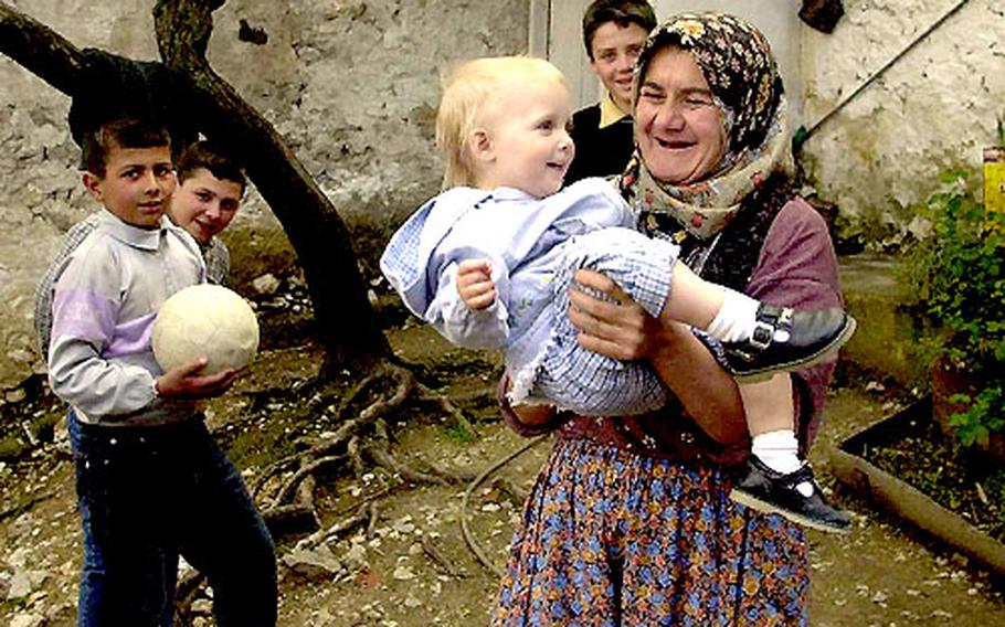 Why deprive your kids of interesting cultural experiences just because they’re not adults? Children tend to adapt readily if visiting “exotic” villages and cultures becomes routine. Here Lale Boyd, 18 months, makes friends with a village woman near Bergama in Turkey.