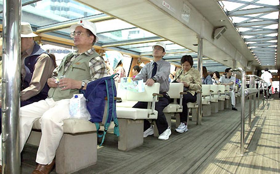 Passengers on one of the many ferries cruise around Tokyo Bay.