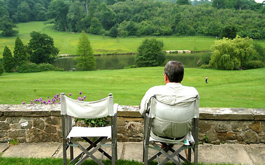 A man sits in the garden at Chartwell, the home of Winston Churchill, above a rolling landscape that was Churchill’s view for more than 40 years.