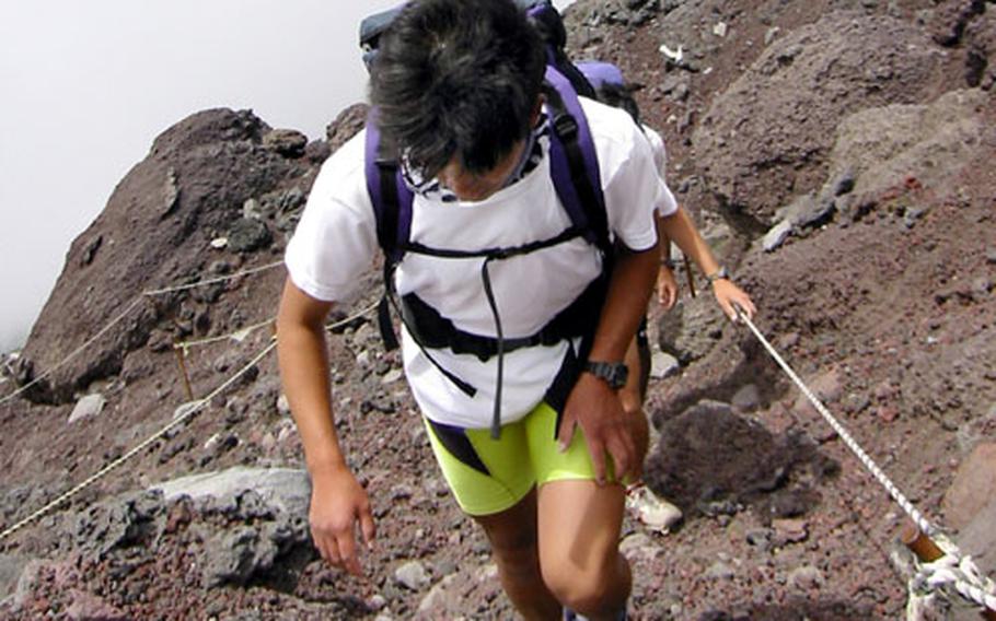The trail becomes steeper and steeper during the ascent. Near the seventh station, hikers face more difficult terrain and must scramble over fantastic geologic formations.