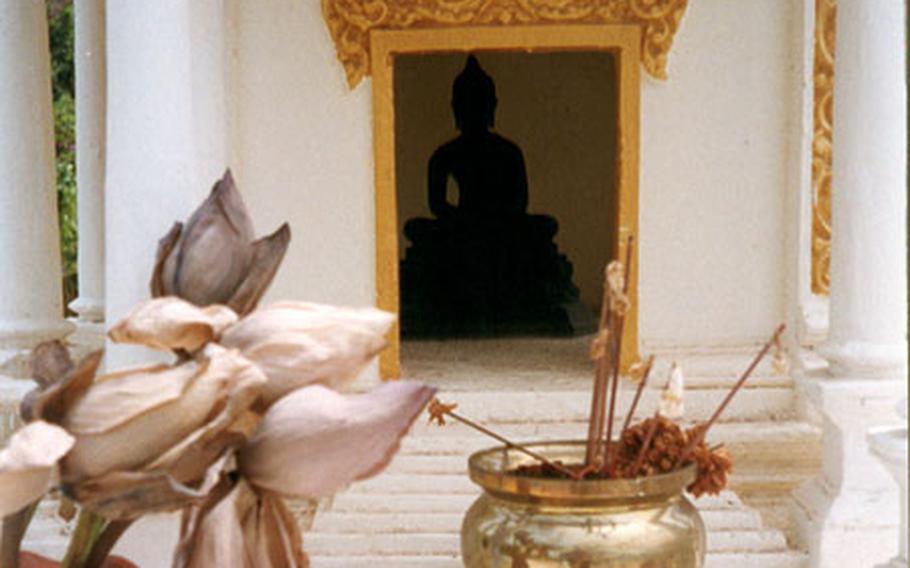 The Royal Palace grounds are filled with small monuments to Buddha.