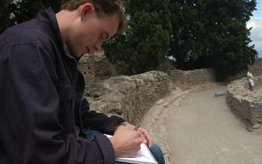 The ruins are a wonderland for photographers and artists. Many visitors, like this architect student from Yale, are content to sit and sketch the city.