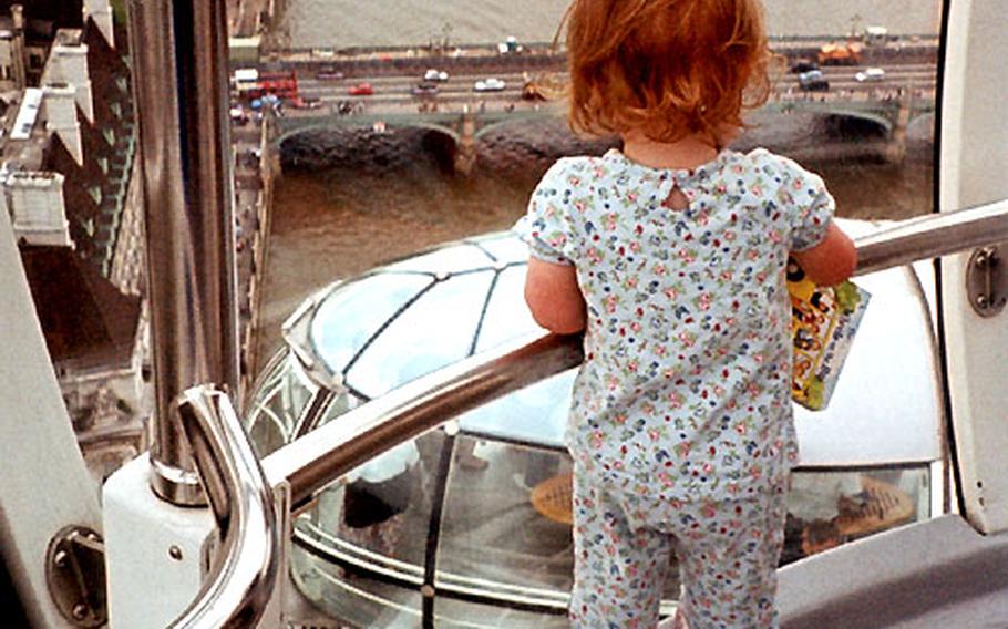 A toddler watches another capsule as it rises into view. The Eye moves so slowly and smoothly that children — and those with motion sickness — don’t seem to be bothered by it.