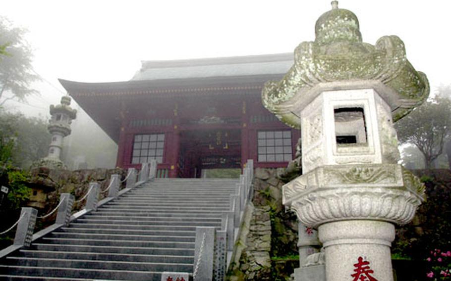 Not quite to the top yet, you pass through a shrine gate which leads to more stairs.