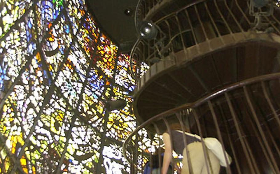 At the Hakone Open Air Museum, the Symphonic Sculpture the spiral staircase is encased in a wall of stained glass.