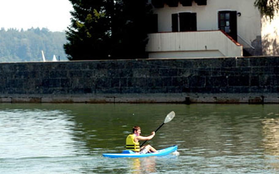 Kayaking on the Chiemsee, with AFRC Chiemsee&#39;s Lake Hotel in the background.