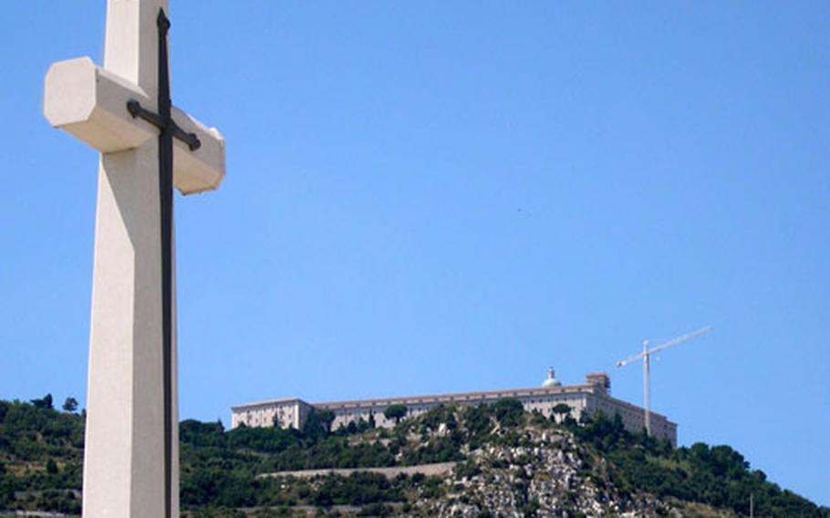 The Abbey of Montecassino sits overlooking the town of Cassino and the British Commonwealth military cemetery, whose marble cross, shown here, overlooks 4,266 graves. In addition to those from the United Kingdom, Indians, Pakistanis, Canadians, Bangladeshis and even one soldier from the Soviet Union are buried in the cemetery.
