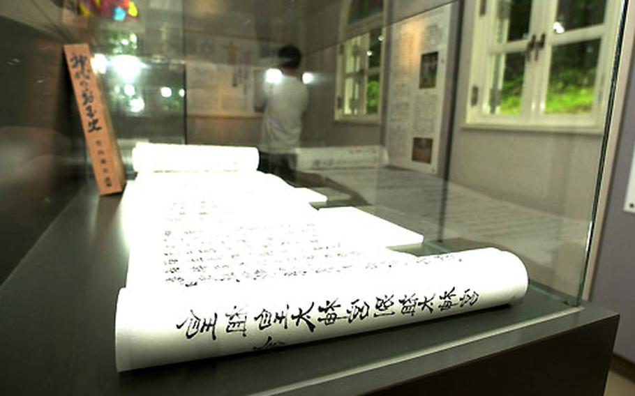 A supposed copy of what is purportedly Jesus’ will is encased in a glass display case at the museum in Shingo.