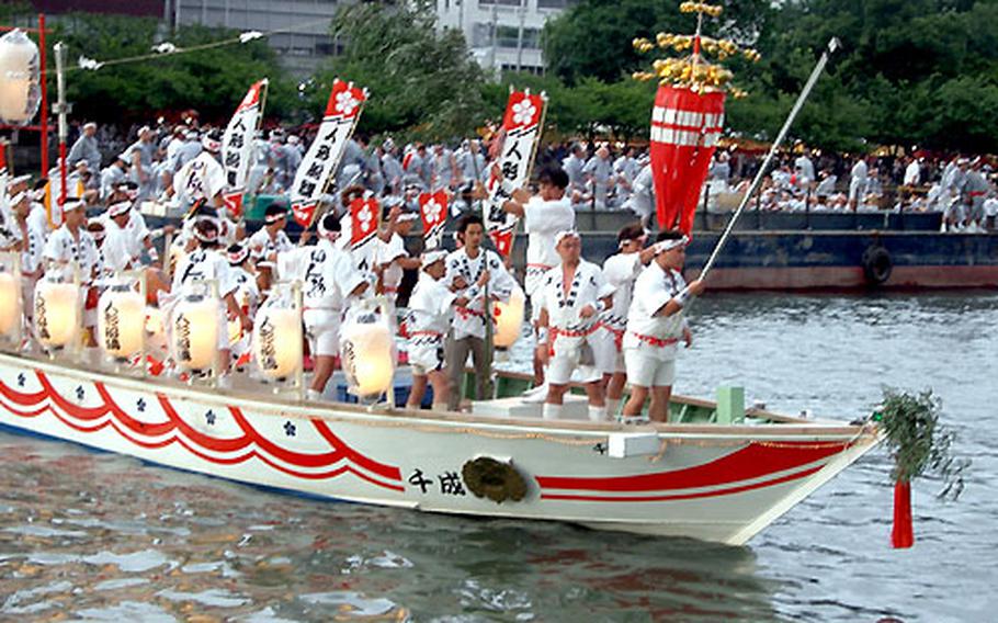 A traditional part of the Tenjin Matsuri festival are decorated halberds, or spears, symbolizing the sacred spear that was launched in the river more than a millennia ago. Where it landed, residents built Temmangu Shrine — which the Tenjin Matsuri Festival honors.