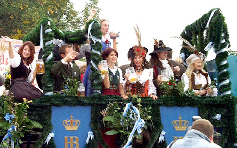 Oktoberfest&#39;s opening day parade features tent proprietors&#39; floats bedecked with girls hoisting beer mugs.