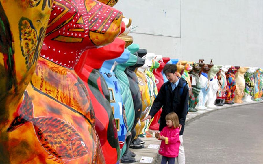 The writer, Theresa McMillan Wesson, and daughter, Caitlin Adaline, admire the bear representing the United States in the massive display of “United Buddy Bears,” outside of the Brandenburg Gate. The display includes bears representing countries from all over the world.