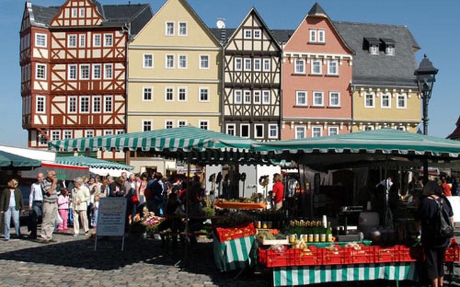 The Marktplatz, or market place, at the Hessenpark. None of the buildings at this open-air museum originaly stood here. Historical buildings in towns and villages in the German state of Hesse that were in disrepair were dismantled, restored and rebuilt here at the park. The farmers&#39; market seen in this photo takes place five or six times a year. The next and final market for 2003 takes place Oct. 12.