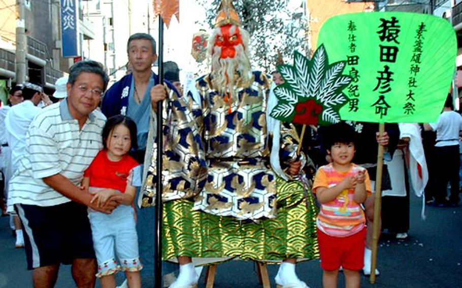 A Shinto god Sarutahiko (who is said to have led the vanguard of offspring of Amaterasu Omi no Kami to descend on earth) leads the parade at Susanoo Shrine in Minami Senju, Tokyo.