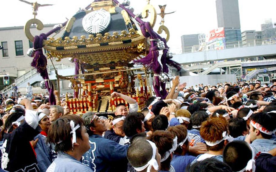 A mikoshi of Shitaya Shrine in Ueno Tokyo on parade near JR Ueno Station.