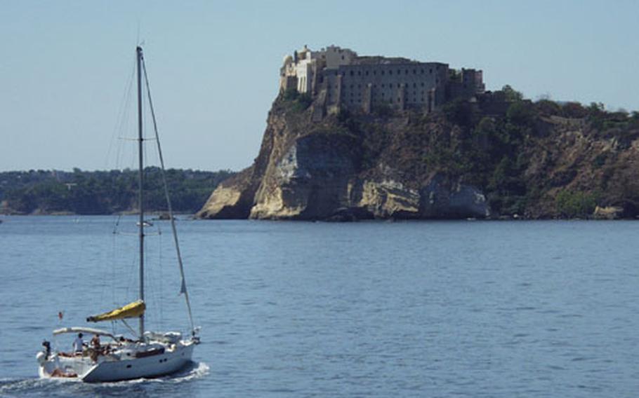 A boat sails past a former penitentiary and the Abbey of San Michele Arcangelo (on the upper left), the patron saint of Procida. The abbey has a small museum and catacombs that are open to the public.
