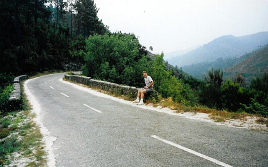 Chuck Wright takes a break from the tight curves and steep slopes of the road leading into Portugal from Spain.