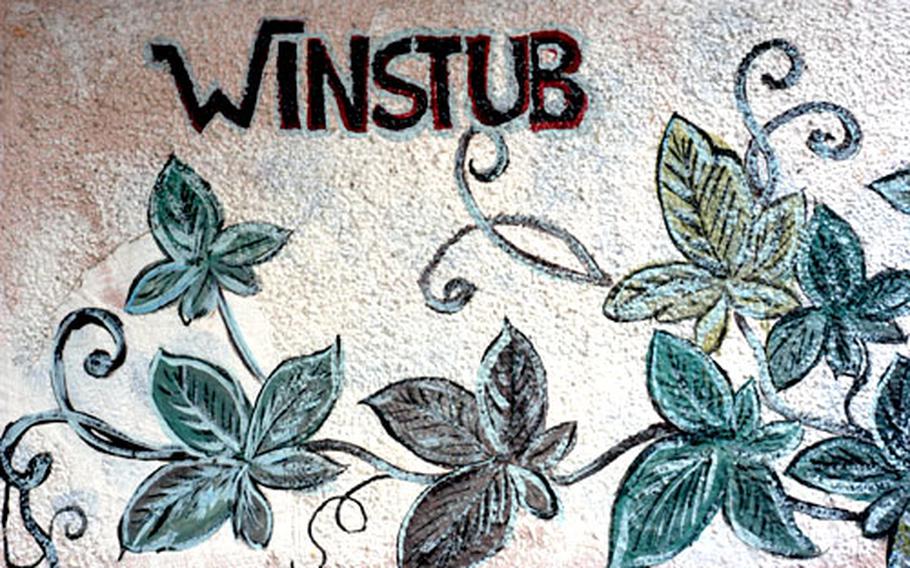 A sign for a Winstub, or wine tavern, in Strasbourg, France. The Alsace region of France is renowned for its white wines.