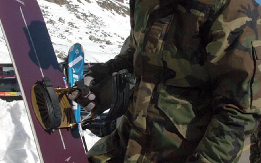 Airman 1st Class Alex Levy checks out his rental snowboard before hitting the slopes at the Rettenbach glacier. Levy and three friends took a spur-of-the-moment road trip to Sölden.