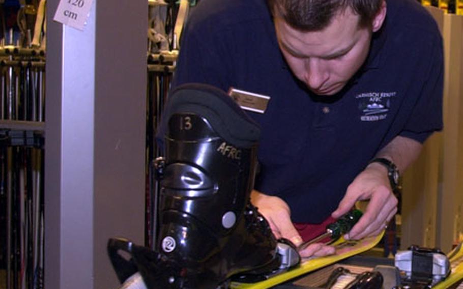 Davis Trent adjusts the bindings on a ski at the AFRC Garmisch Hausberg Lodge.