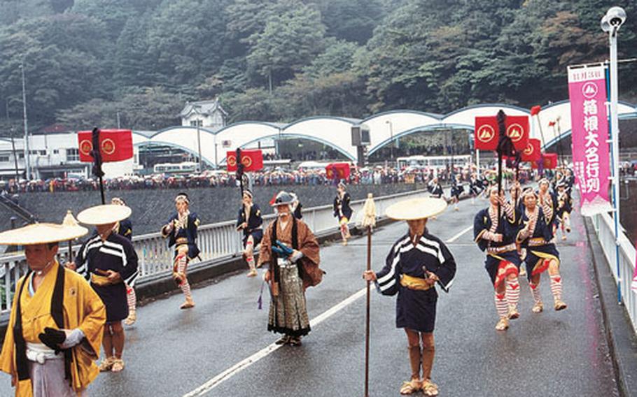 Re-enactment by 200 costumed locals of a feudal lord&#39;s procession. The old highway passing through the mountains of Hakone resounds with cries of "Down! Down!" meaning "Prostrate yourselves!" as the daimyo procession passes by.