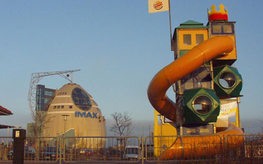 Though popular with Germans, parts of MainFrankenPark have a distinctly American flavor, including the Burger King with a children&#39;s play area in front. In the background is the IMAX theater.