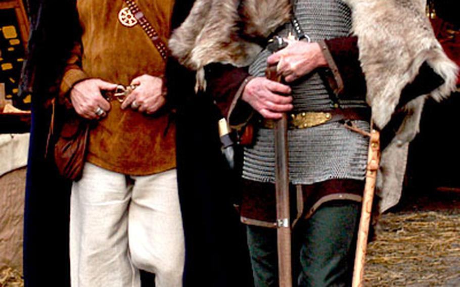 Two warriors walk through the market at Ronneburg castle. Most of the vendors and many of the visitors are fans of medieval life, and dress true to the fashion of the time.