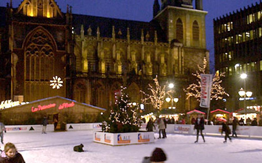 A child skates near the Liège cathedral.